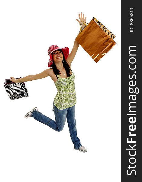 Full body view of young attractive woman in casual wear, going shopping with lots of colorful shopping bags. Isolated on white background. Full body view of young attractive woman in casual wear, going shopping with lots of colorful shopping bags. Isolated on white background.