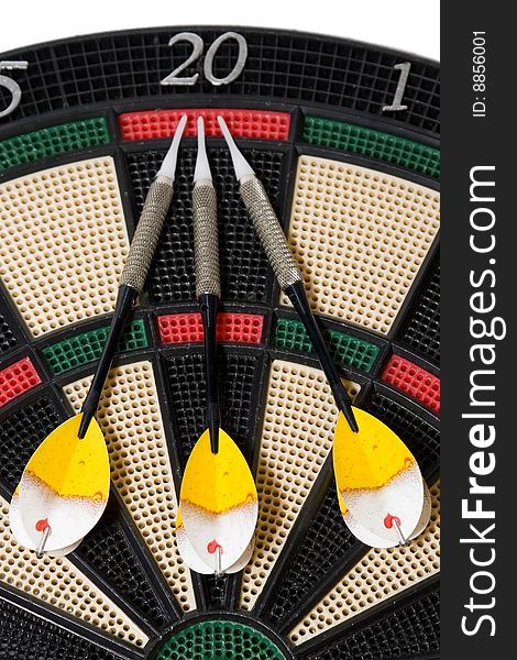 Three darts on colored dartboard