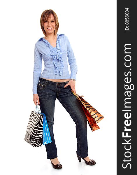 Full body view of young attractive woman going shopping with lots of colorful shopping bags. Isolated on white background. Full body view of young attractive woman going shopping with lots of colorful shopping bags. Isolated on white background.