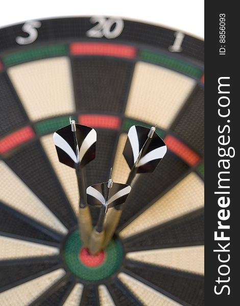 Three darts on colored dartboard