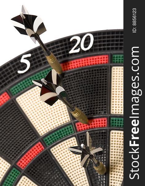 Three darts on colored dartboard