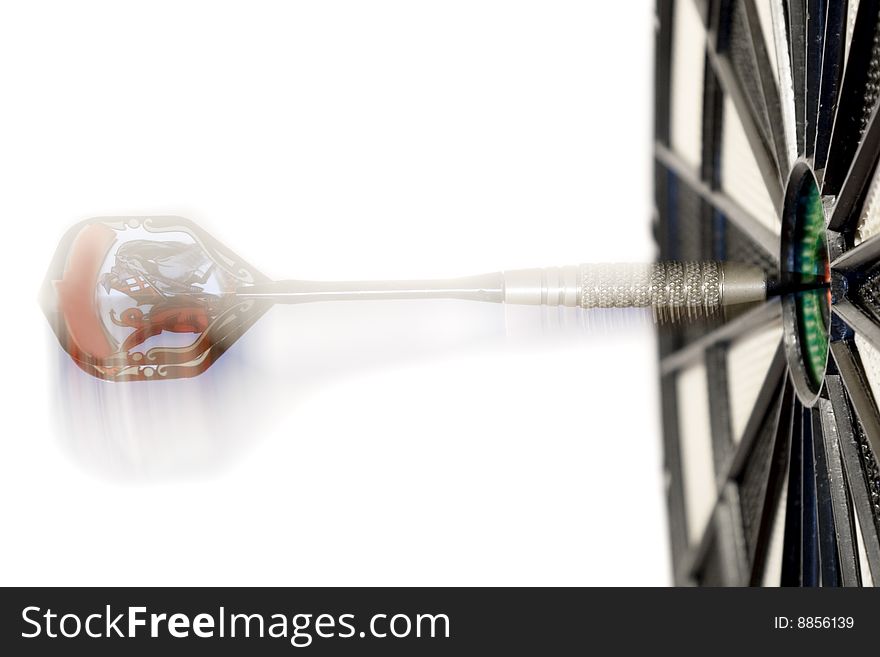 Shallow depth of field shot of darts in bullseye on dartboard