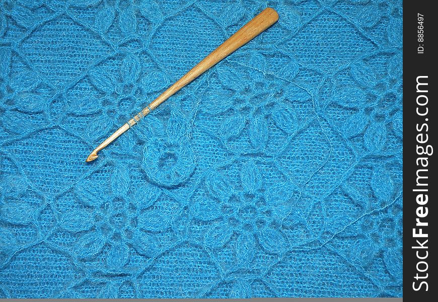 Blue crochet and hook for background