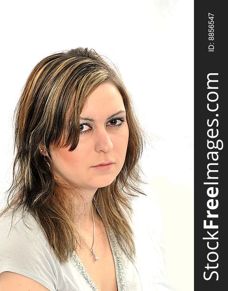 Studio Shot of a brunette woman with big brown eyes, isolated on white background. Studio Shot of a brunette woman with big brown eyes, isolated on white background