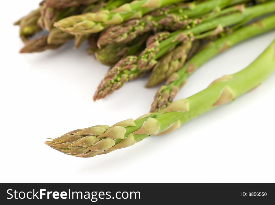 Close up shot of asparagus with shallow depth of field on white background