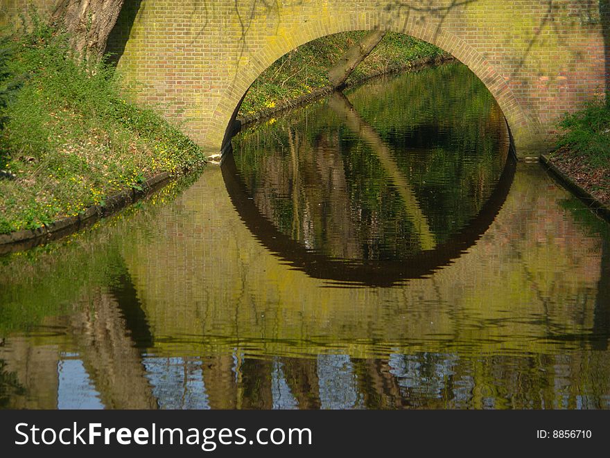 This is a detail of a bridge reflected on the water. This photo was shot in Utrech (Holland). This is a detail of a bridge reflected on the water. This photo was shot in Utrech (Holland)