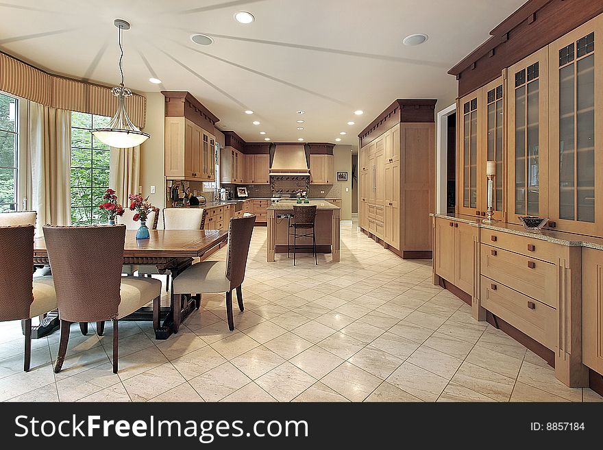 Large kitchen in earth tones with eating area. Large kitchen in earth tones with eating area
