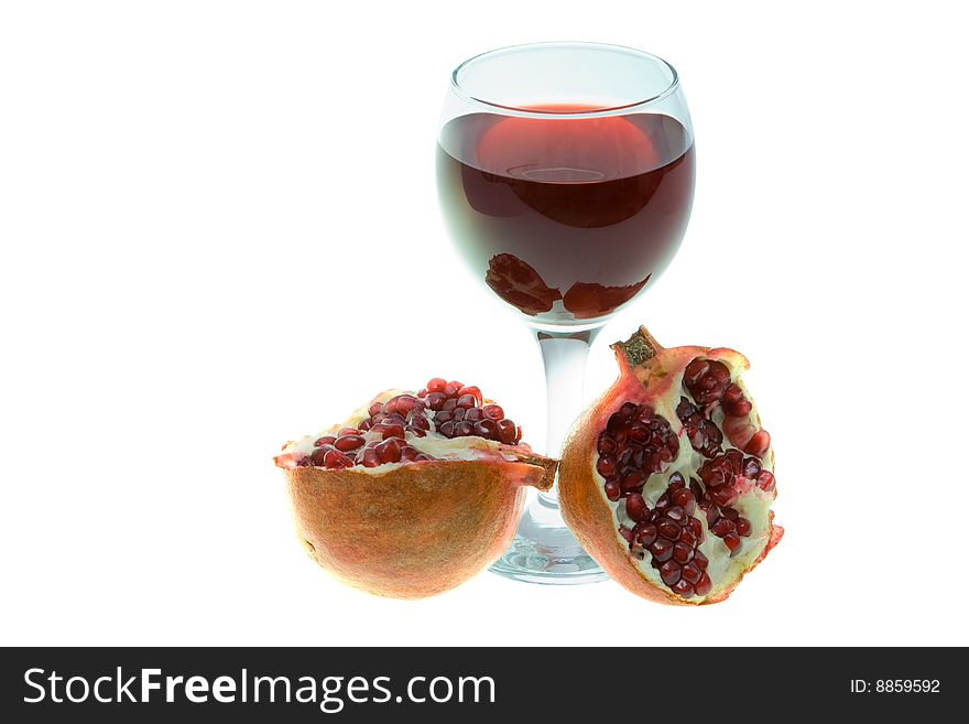 Glass of pomegranate juice with fruits isolated on white. Glass of pomegranate juice with fruits isolated on white
