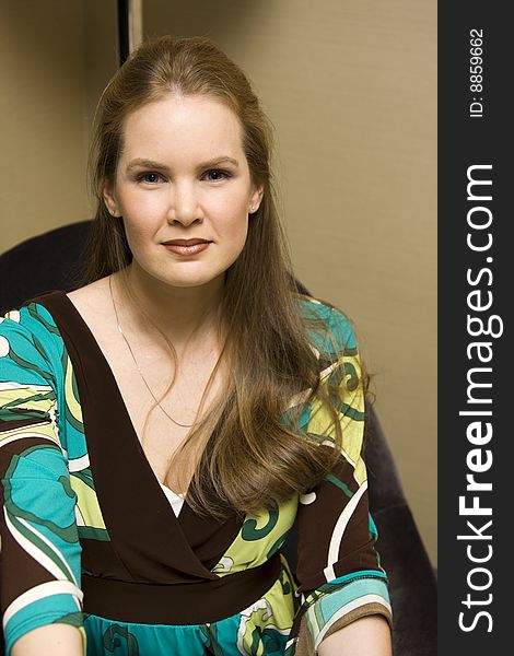 Young Attractive Female Smiling on Chair