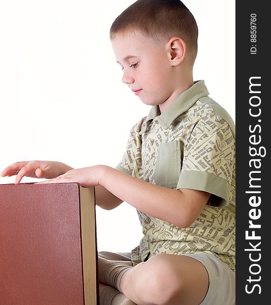 The child with book on the white