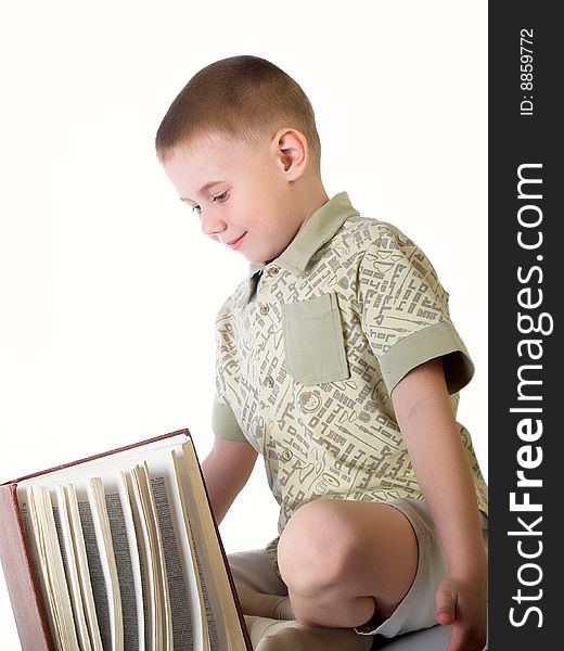 The child with book on the white