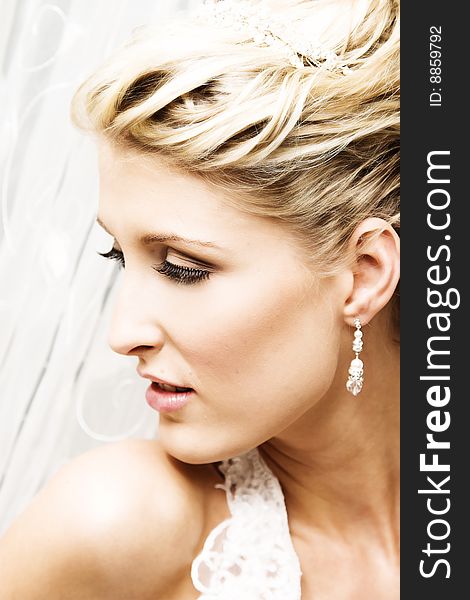 Beautiful Blond bride wearing diamond jewelery and tiara. Beautiful Blond bride wearing diamond jewelery and tiara