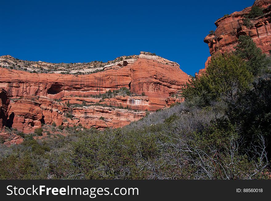 Boynton Canyon is one of the most scenic of the box canyons that make Arizona&#x27;s Red Rock Country so famous. The trail starts out by skirting a luxury resort, then returns to the canyon floor where the walking is pleasant and easy. The canyon gradually becomes narrower, entering Red Rock-Secret Mountain Wilderness, and ending at a box at the base of Secret Mountain. Photo by Deborah Lee Soltesz, February 2011. Credit: U.S. Forest Service, Coconino National Forest. For more information about this trail, see the Boynton Canyon No. 47 trail description on the Coconino National Forest website. Boynton Canyon is one of the most scenic of the box canyons that make Arizona&#x27;s Red Rock Country so famous. The trail starts out by skirting a luxury resort, then returns to the canyon floor where the walking is pleasant and easy. The canyon gradually becomes narrower, entering Red Rock-Secret Mountain Wilderness, and ending at a box at the base of Secret Mountain. Photo by Deborah Lee Soltesz, February 2011. Credit: U.S. Forest Service, Coconino National Forest. For more information about this trail, see the Boynton Canyon No. 47 trail description on the Coconino National Forest website.