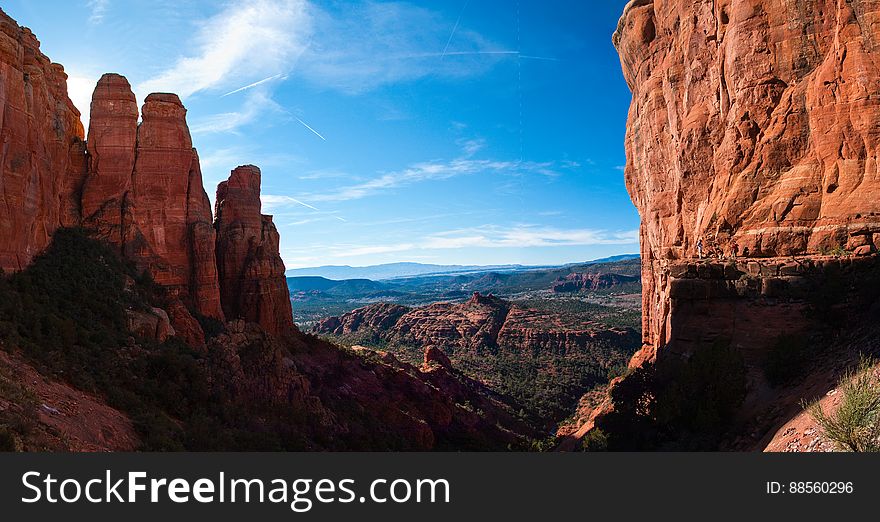 View from the saddle on Cathedral Rock. Cathedral Rock Trail ascends one of the most recognizable rock formations in the heart of Red Rock Country. Many visitors hike the first quarter mile to enjoy the fantastic views from the first ledge, where the trail meets Templeton Trail. From here, the trail becomes as much a rock climb as a hike, requiring non-technical scrambling up rock faces and ledges to make it to the final ascent to the top. The saddle between two spires offers spectacular views. The unmaintained trail explores the lava and spires at the top. Photo by Deborah Lee Soltesz, January 12, 2011. Credit: USFS Coconino National Forest. Learn more about hiking Cathedral Rock Trail No. 170 in the Red Rock Ranger District of the Coconino National Forest website.