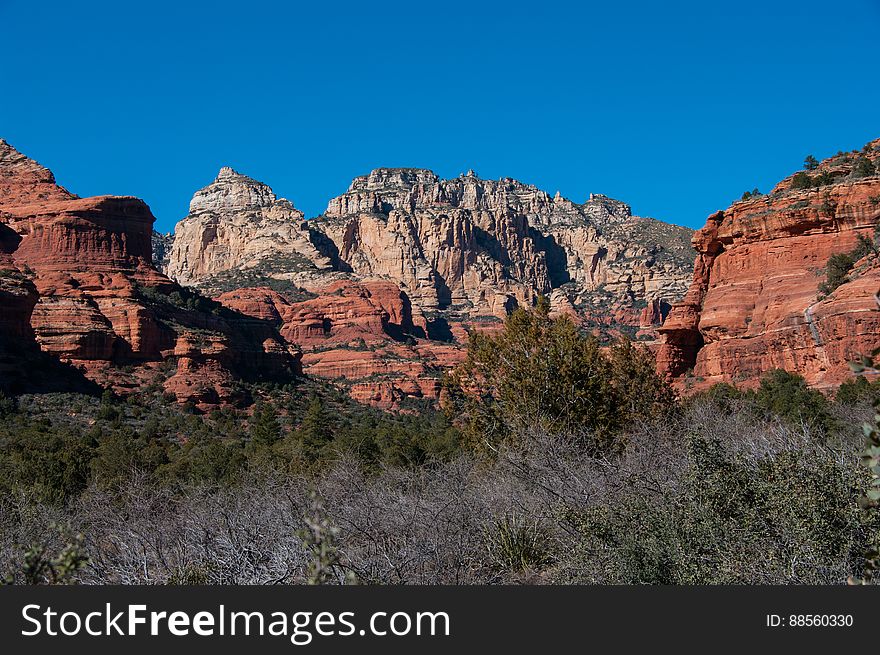 Boynton Canyon is one of the most scenic of the box canyons that make Arizona&#x27;s Red Rock Country so famous. The trail starts out by skirting a luxury resort, then returns to the canyon floor where the walking is pleasant and easy. The canyon gradually becomes narrower, entering Red Rock-Secret Mountain Wilderness, and ending at a box at the base of Secret Mountain. Photo by Deborah Lee Soltesz, February 2011. Credit: U.S. Forest Service, Coconino National Forest. For more information about this trail, see the Boynton Canyon No. 47 trail description on the Coconino National Forest website. Boynton Canyon is one of the most scenic of the box canyons that make Arizona&#x27;s Red Rock Country so famous. The trail starts out by skirting a luxury resort, then returns to the canyon floor where the walking is pleasant and easy. The canyon gradually becomes narrower, entering Red Rock-Secret Mountain Wilderness, and ending at a box at the base of Secret Mountain. Photo by Deborah Lee Soltesz, February 2011. Credit: U.S. Forest Service, Coconino National Forest. For more information about this trail, see the Boynton Canyon No. 47 trail description on the Coconino National Forest website.