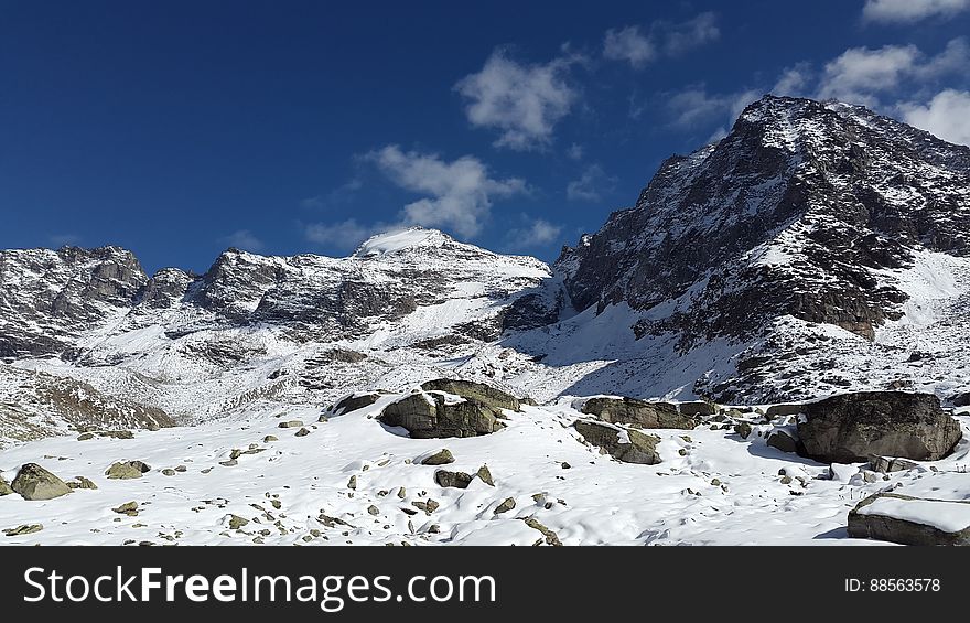 A rocky mountain peak in winter.