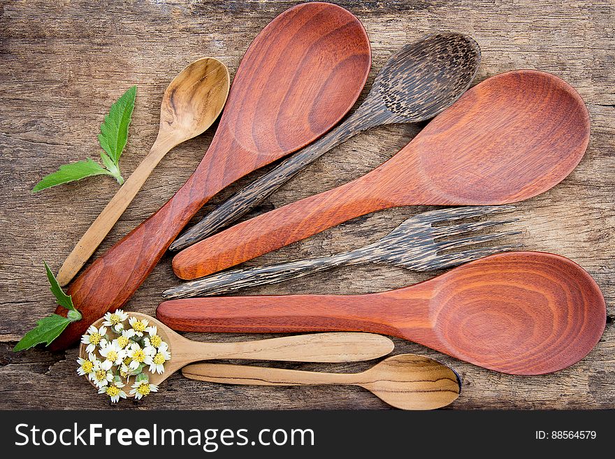 Wooden spoons on wooden background. Wooden spoons on wooden background.