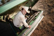 Man Under The Hood Of His Truck Stock Photo