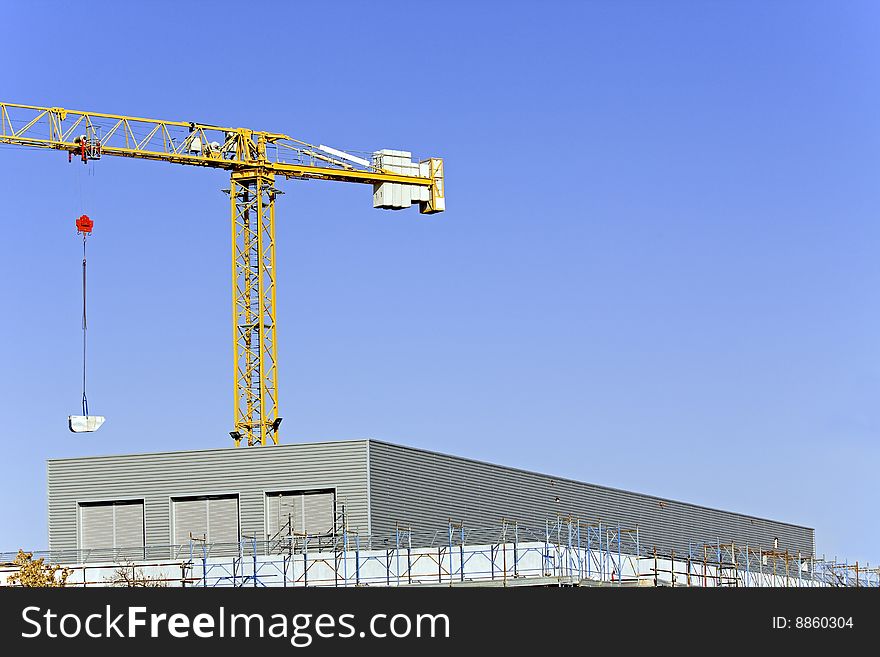 Scaffolds for the construction and crane. Scaffolds for the construction and crane