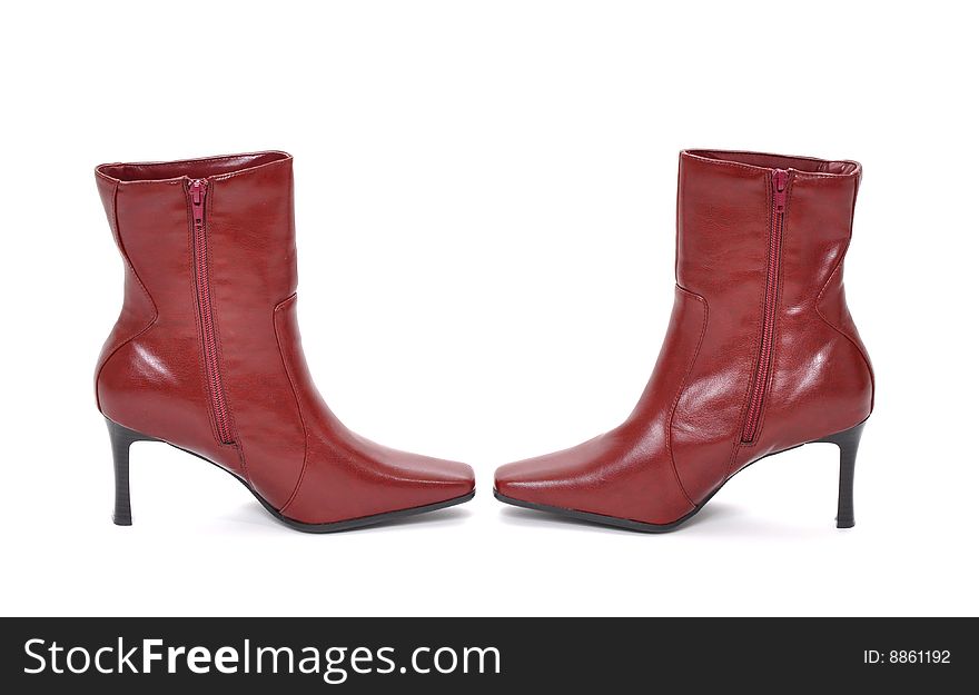 Red boots pointing at each other on a white background. Red boots pointing at each other on a white background