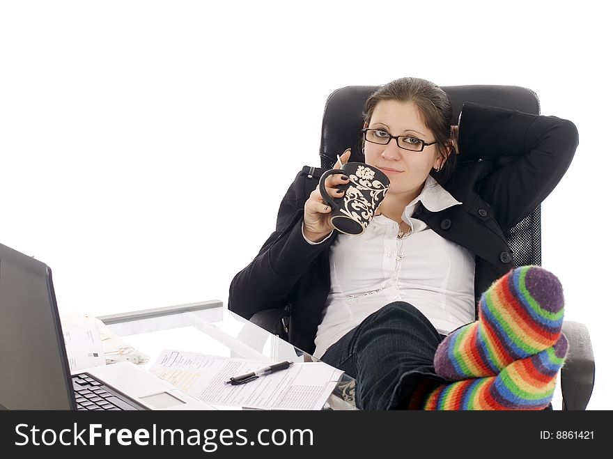 A young woman taking a break in her office. A young woman taking a break in her office
