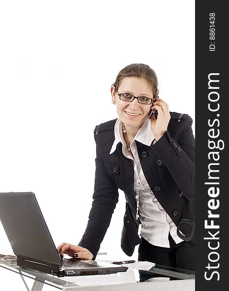 A young business woman working in her office, isolated on white. A young business woman working in her office, isolated on white