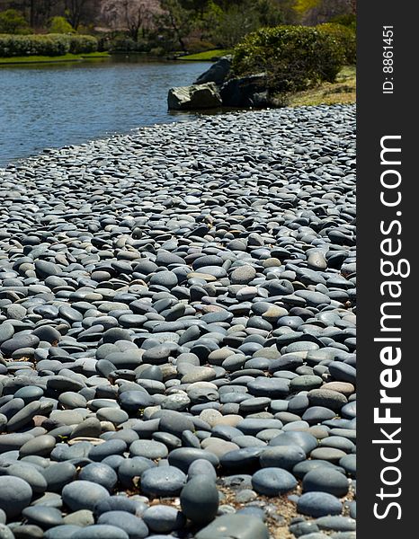 Flat gray stones on a beach. Flat gray stones on a beach