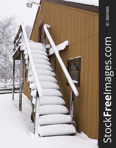 Stairs of a barn covered deep in snow. Stairs of a barn covered deep in snow.