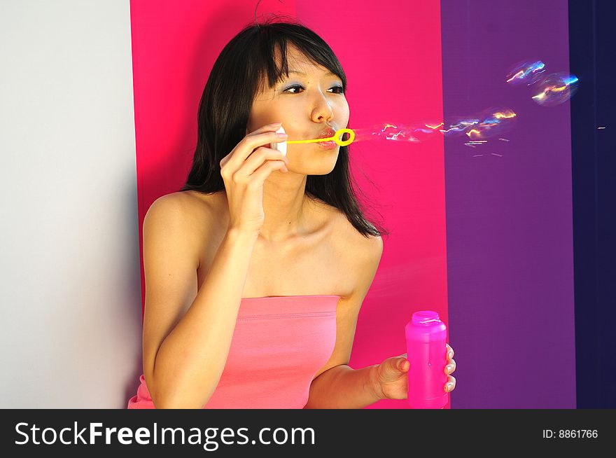 Beautiful Chinese Girl Having Fun With Bubbles