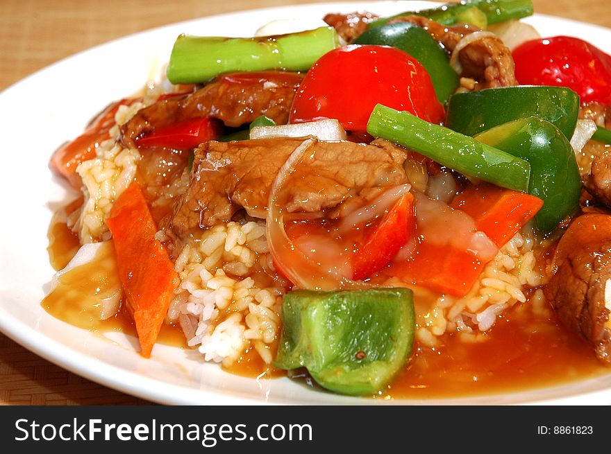 Seasoned beef and peppers over rice