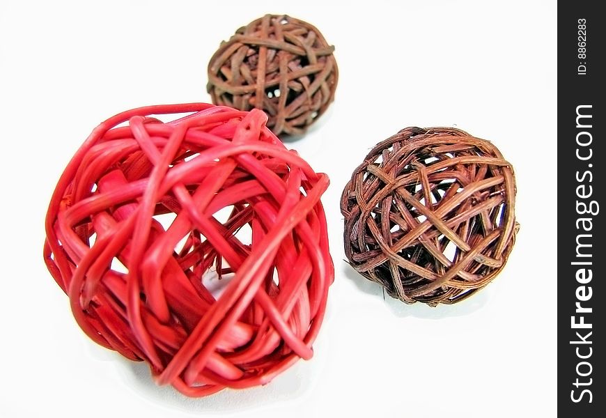 Decoration wicker balls in red and brown colors. Isolated.