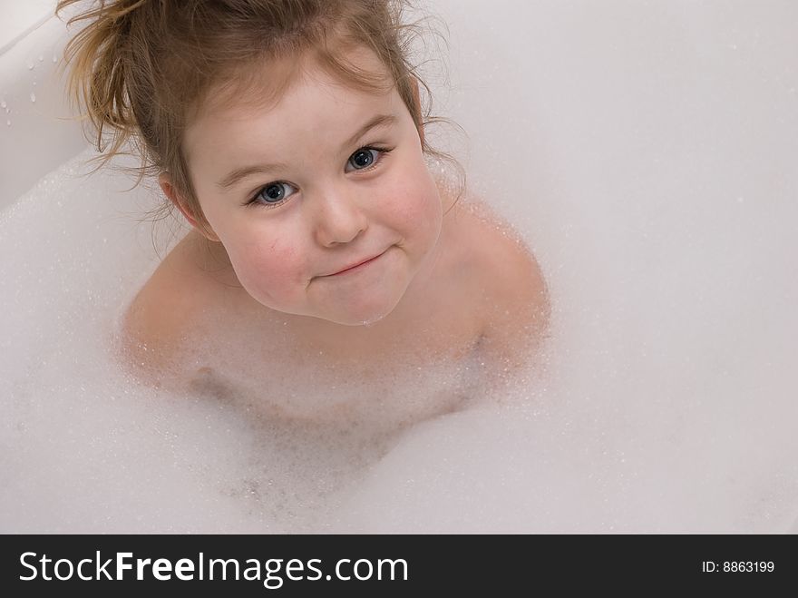 Little girl's portrait in the bathtub. Little girl's portrait in the bathtub