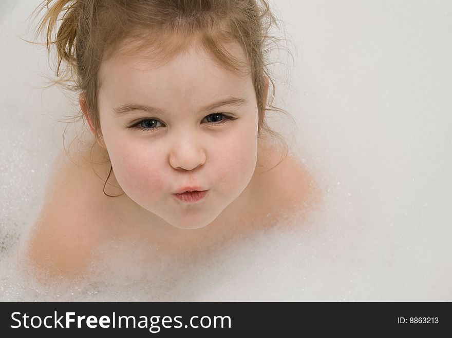 Little girl's portrait in the bathtub. Little girl's portrait in the bathtub