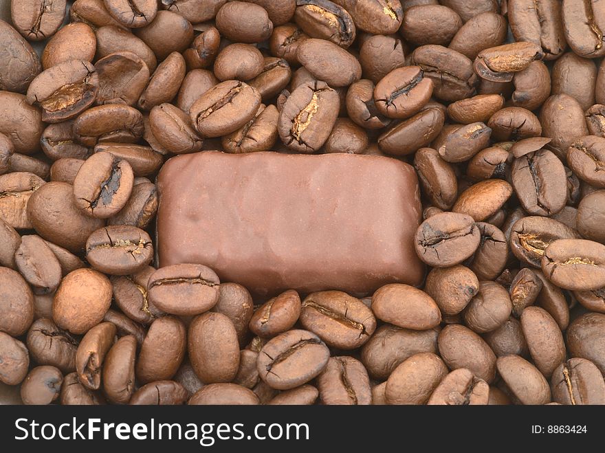 Chocolate On The Coffee Beans Background
