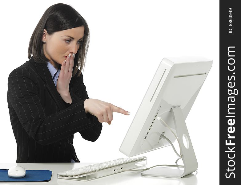 Beautiful businesswoman in her office indicating something on laptop