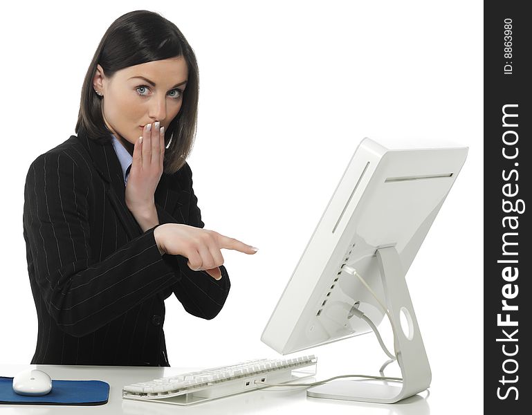 Beautiful businesswoman in her office indicating something on laptop