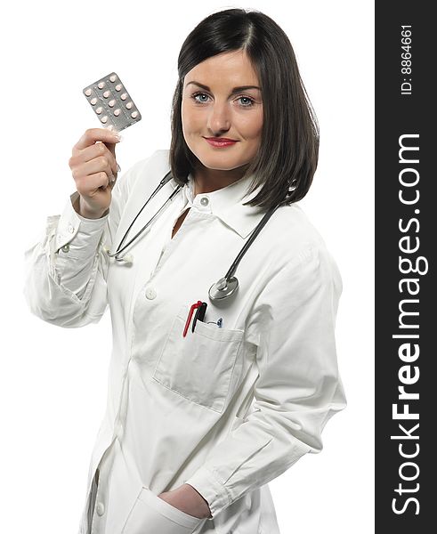 Female doctor handing medicine isolated on white