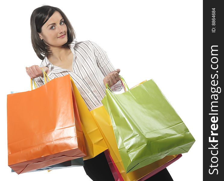 Portrait of one happy young adult girl with colored bags