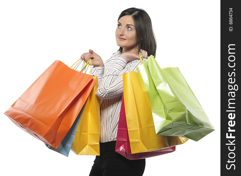 Portrait of one happy young adult girl with colored bags