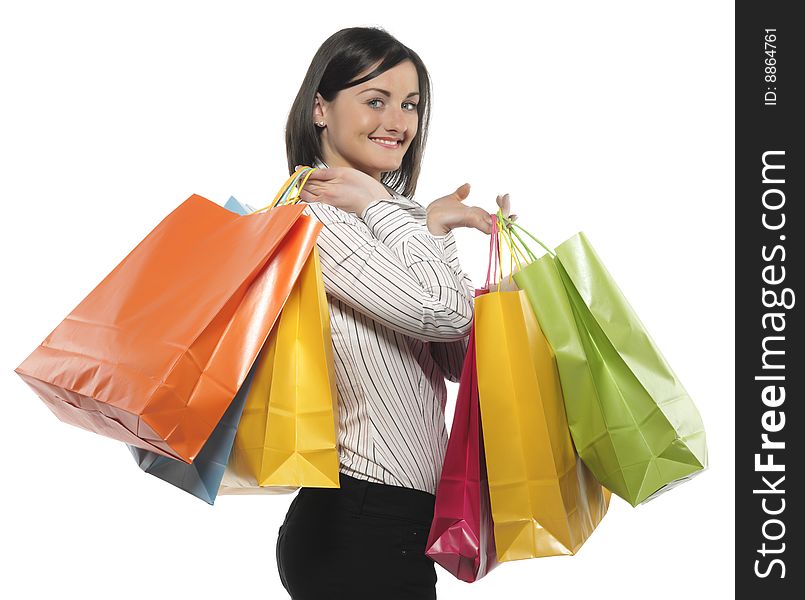 Portrait of one happy young adult girl with colored bags