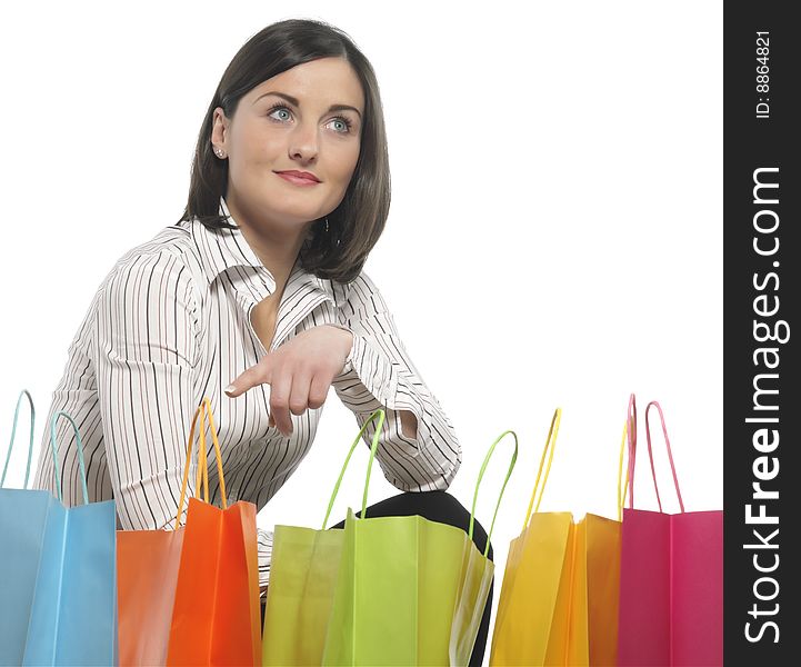 Portrait of one happy young adult girl with colored bags