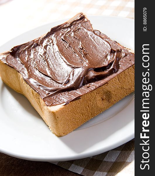 Toast with chocolate sauce on the table