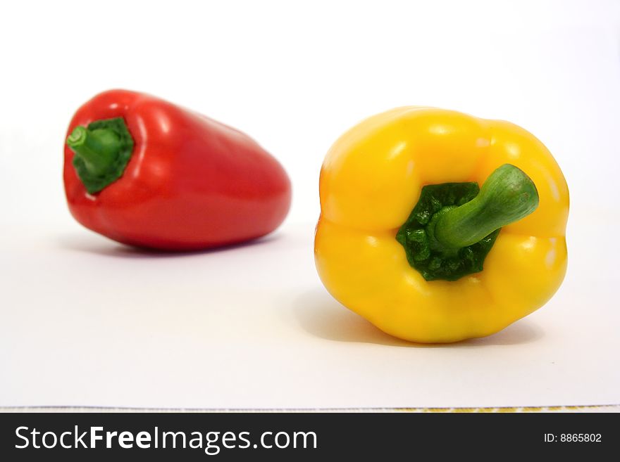 Color peppers full of vitamins on a white background