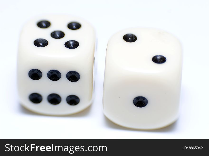 Dice on white background, close-up shot. Dice on white background, close-up shot