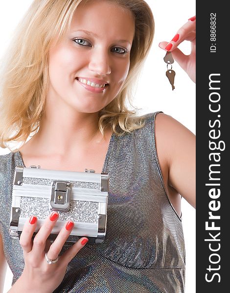 Beautiful girl with a silvery box and keys in hands