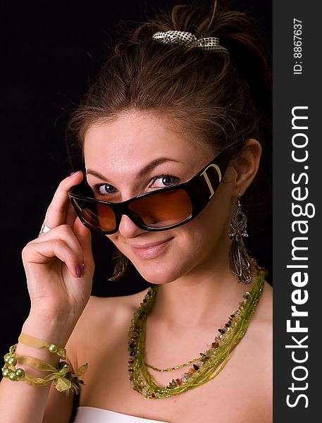 Nice young girl against a black background. Nice young girl against a black background