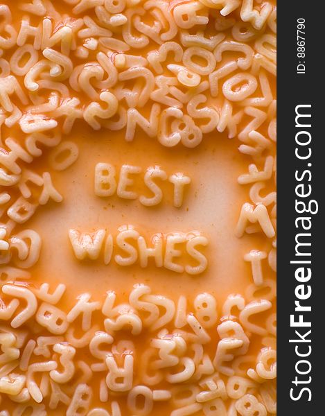 Best wishes text made of alphabet pastries, ketchup