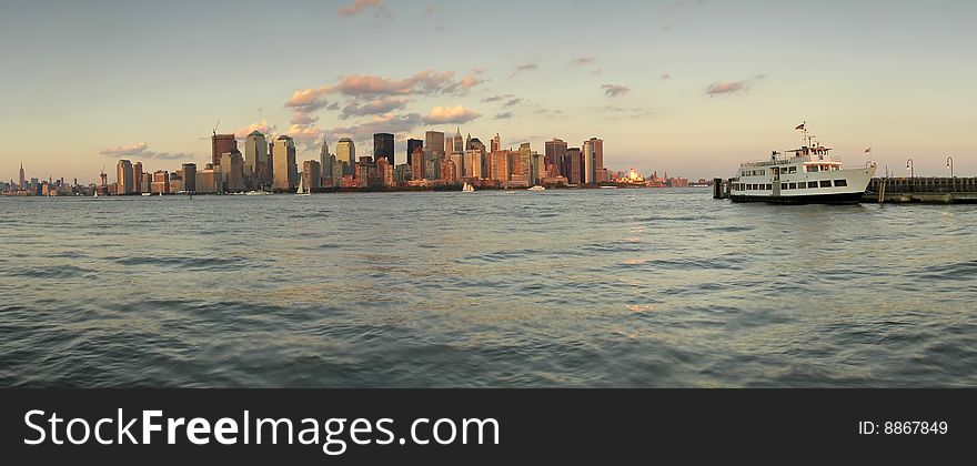 New york's manhattan panorama, photo taken from ellis island, white boat anchoring. New york's manhattan panorama, photo taken from ellis island, white boat anchoring