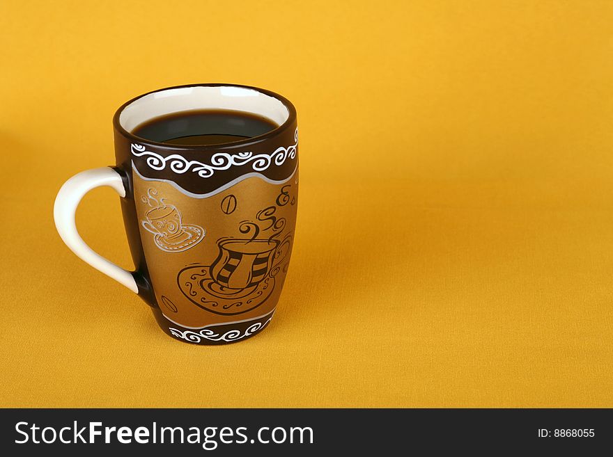 Coffee cup on a yellow background with an empty seat for the signature