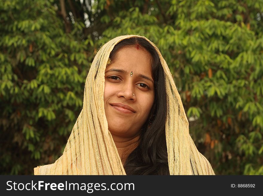 A portrait of a young Indian girl in a soft mood and lovely face.